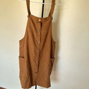 Camel colored button up jumper with pockets